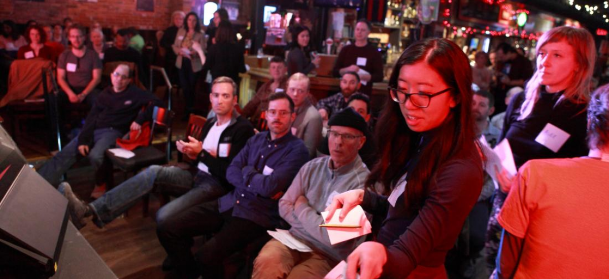 A room full of people in chairs