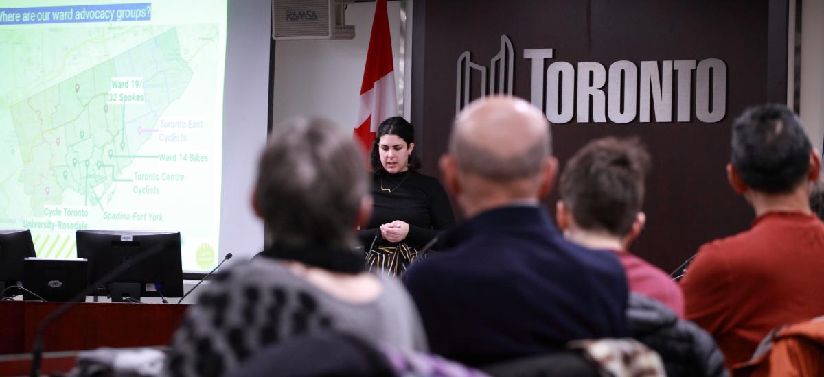 Advocacy Forum Graphic that features the CN Tower and a woman at a podium