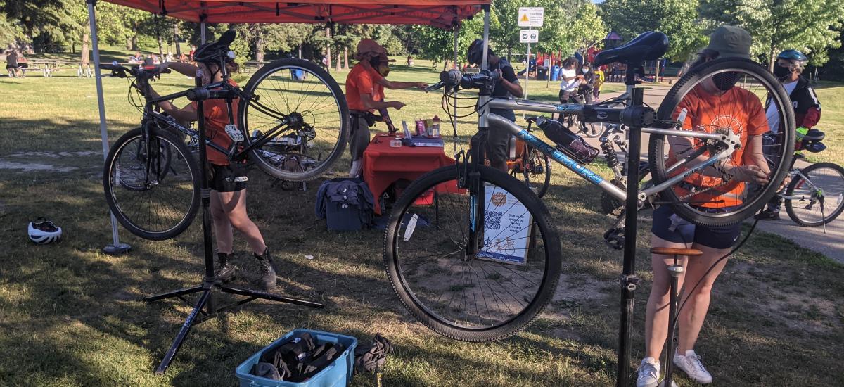 People work on bikes