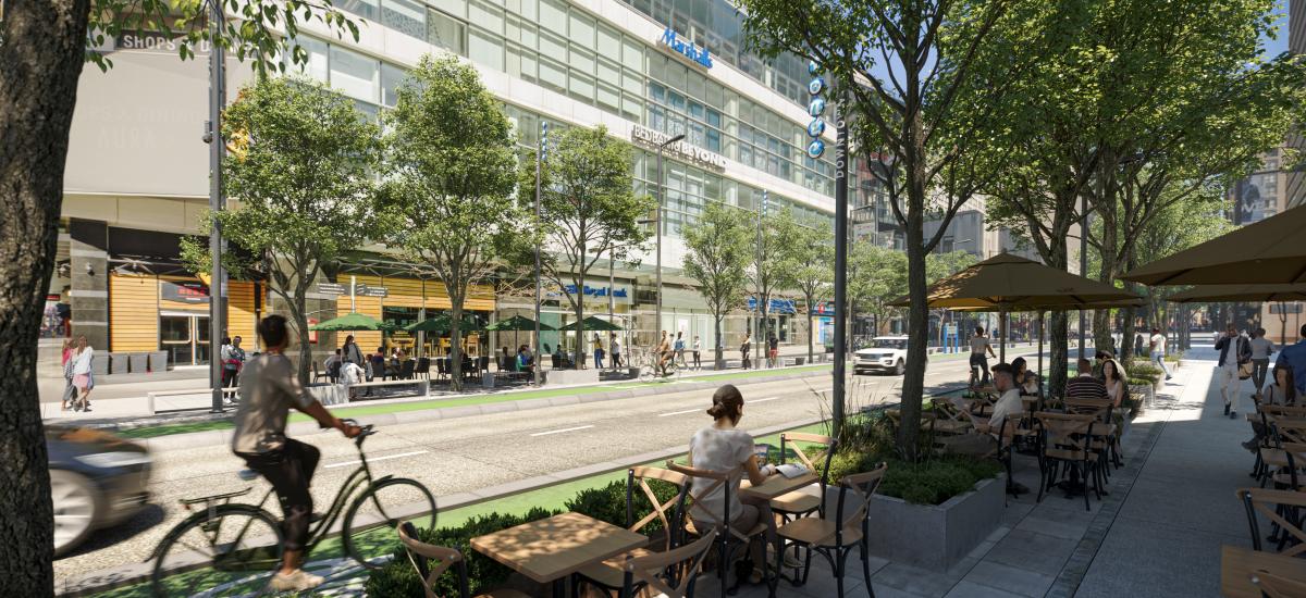 A realistic rendering of Yonge street shows a vibrant patio scene. People ride bikes in a protected bike lane amidst lush trees.