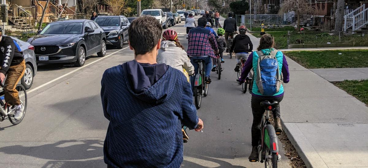 Many people ride bikes on a residential road