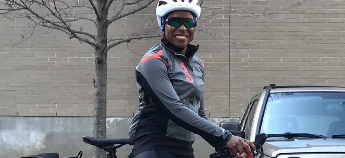 Smiling woman wearing a bike helmet