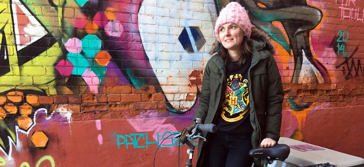 Theresa and her bike outside work