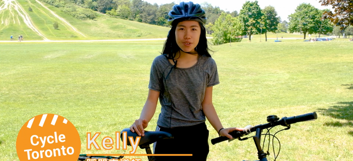 Person standing with a bike in a field