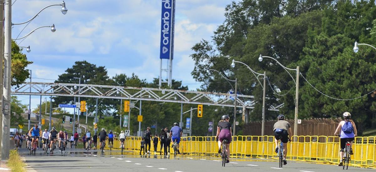 Lake Shore Boulevard West at Ontario Place is open with many people riding bikes on it.