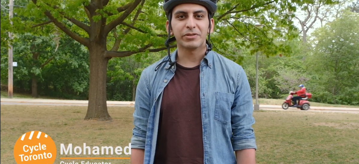 A man wearing a bike helmet in a park. Text reads "Mohammed cycle educator"