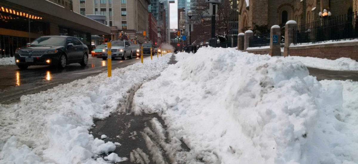 Pile of snow in bike lane on Simcoe