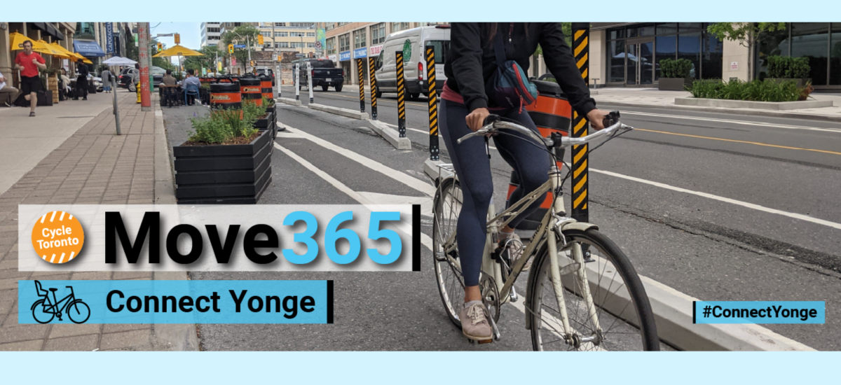 Person riding their bike down Yonge Street protected bike lanes