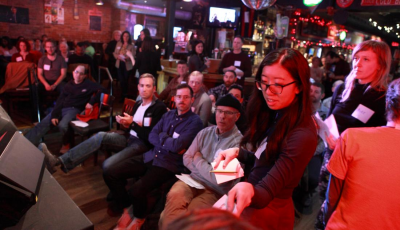 A room full of people in chairs