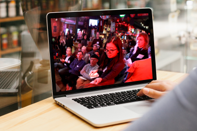 A meeting is being displayed on a laptop