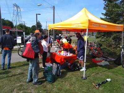 People queue up at a Cycle Toronto tent