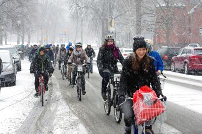 People riding bikes in snow