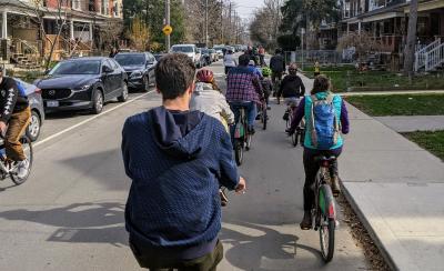 Many people ride bikes on a residential road