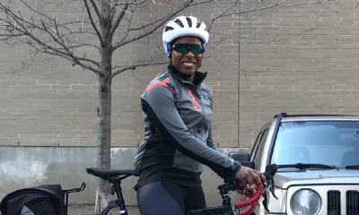 Smiling woman wearing a bike helmet