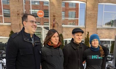 Road safety advocates pose in the cold