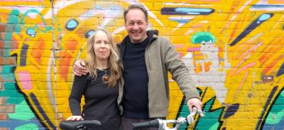 Lorraine and Travis with Travis' new bike outside Urbane Cyclist