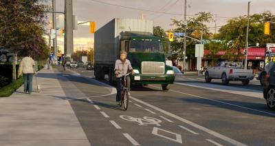 Rendering of The Queensway at the Ontario Food Terminal with bike lanes and heavy trucks