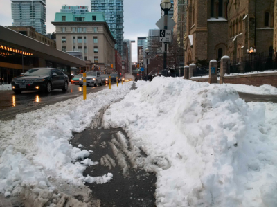 Pile of snow in bike lane on Simcoe
