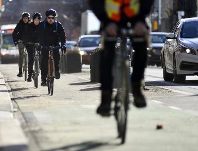 People riding bikes in a protected bike lane