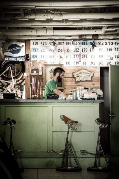 man behind repair desk at a bike shop