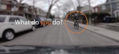 road rules video capture showing woman riding a bike