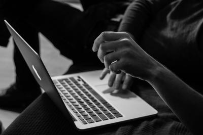 Photo of person working at their computer by Sergey Zolkin