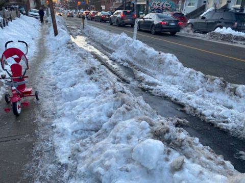 Harbord bike lane covered in a sheet of ice