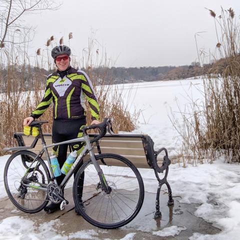 Ry Shissler at High Park with their bike in the winter