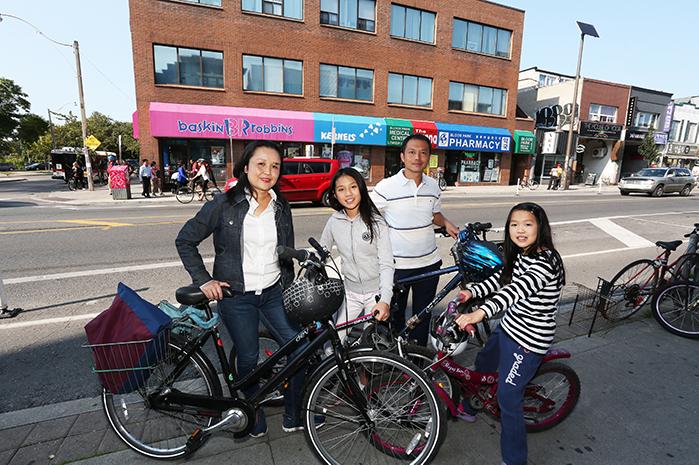 Family with bikes on Bloor St