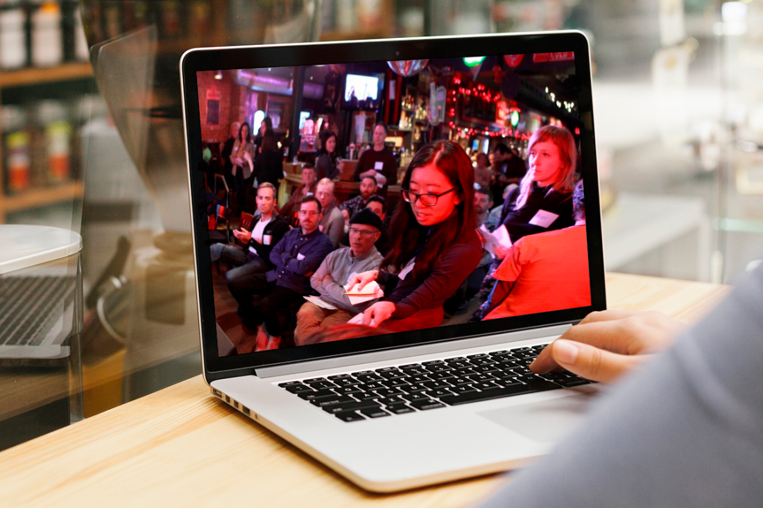 A meeting is being displayed on a laptop