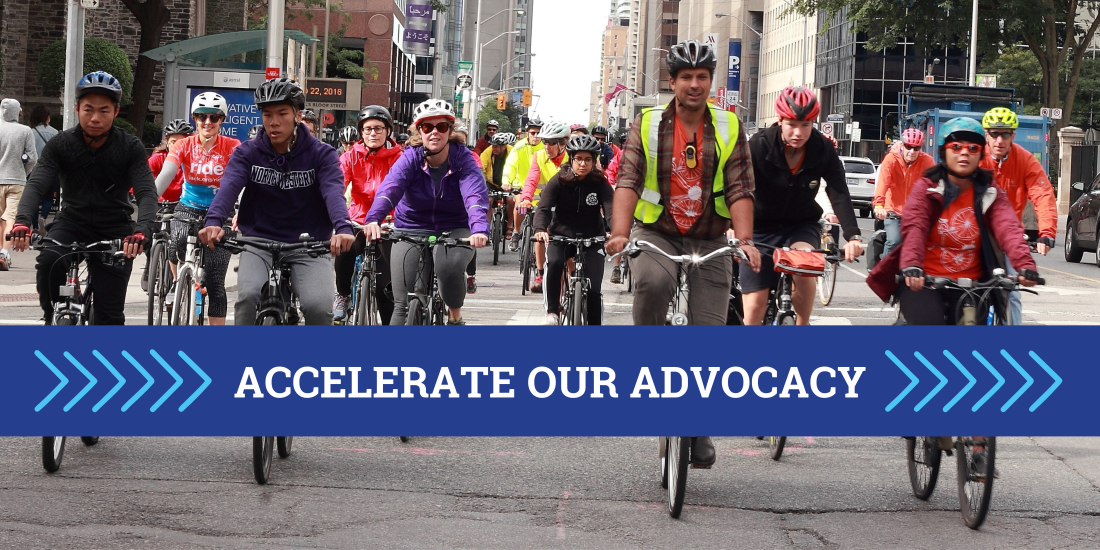 A large group of people ride bikes. Text reads "Accelerate Our Advocacy"