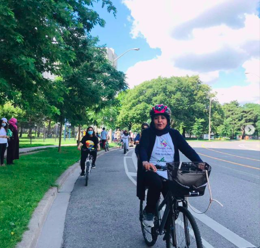 Woman riding a bike in a bike lane