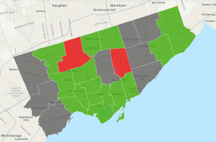 Map of Toronto electoral wards. 15 are highlighted green. 2 are highlighted red. 8 are grey.