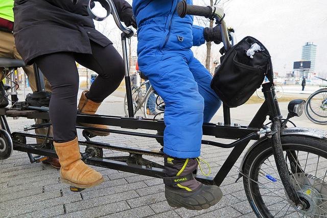 Closeup of the family riding a cargo bike