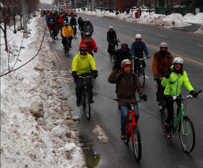 People riding their bikes in the winter, on the coldest day of year ride in 2019